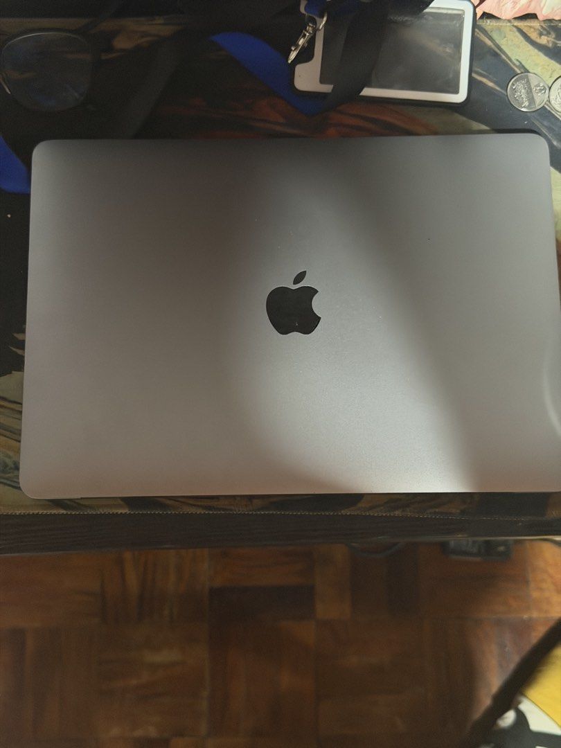 Apple MacBook 2020 I5 Air Space Grey (Category: Laptops & Notebooks) located in Manila. Submitted by gbrail_achi (Listing ID 1465608942, Image 1). Description: - Color: Sleek Space Grey with iconic Apple logo - OS: Running the latest macOS Sequoia - Keyboard & Trackpad: Responsive black keyboard layout and standard trackpad - Condition: Fully functional screen and body - Design: Slim profile with standard rubber feet and bottom screws intact.