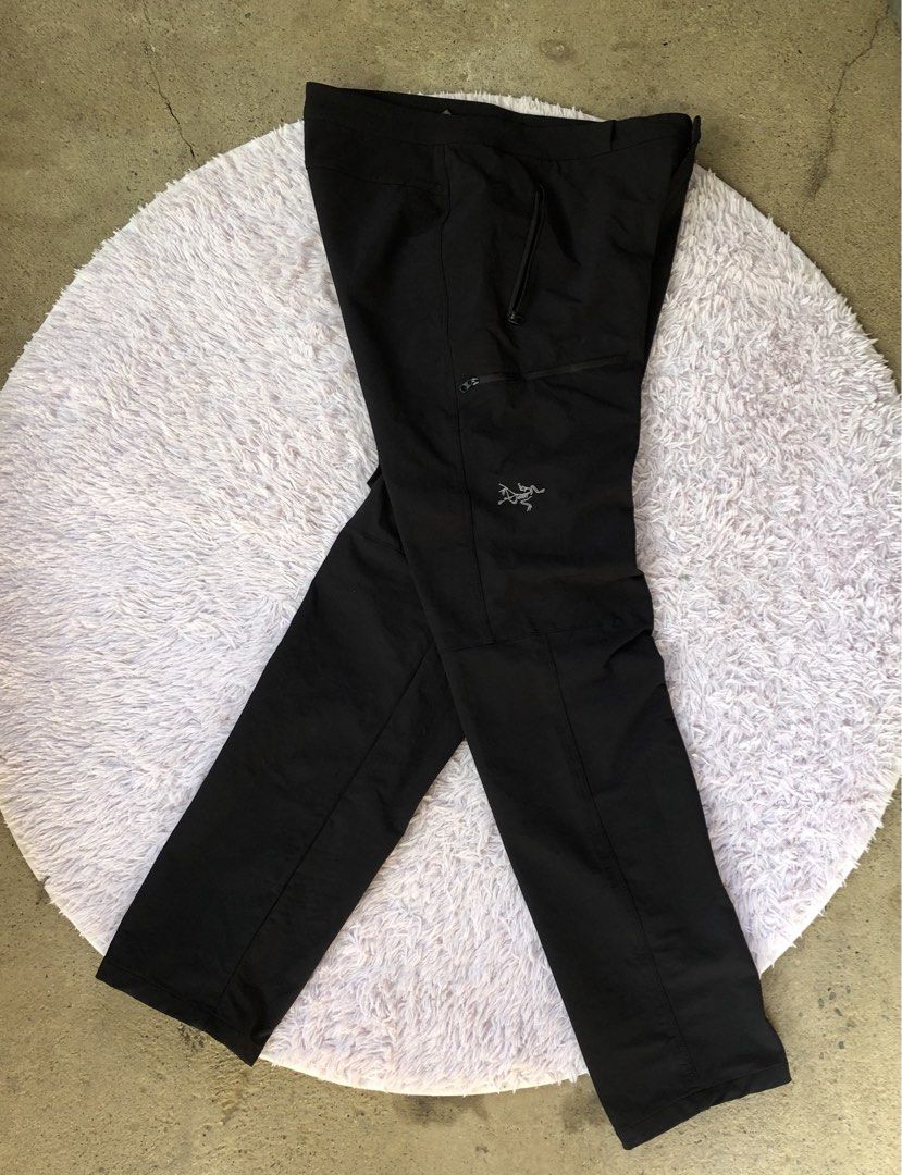Arc'teryx Black Technical Hiking Pants (Category: Trousers) located in Montevista. Submitted by rdthriftshub (Listing ID 1465595041, Image 2). Description: - Brand: Arc'teryx - Color: Black - Material: Durable and stretchy fabric for outdoor movement - Features: Embroidered thigh logo, secure YKK zippered pockets and fly, snap button closure with debossed branding - Condition: Clean finish throughout, perfect for trail use and daily wear - Shippi