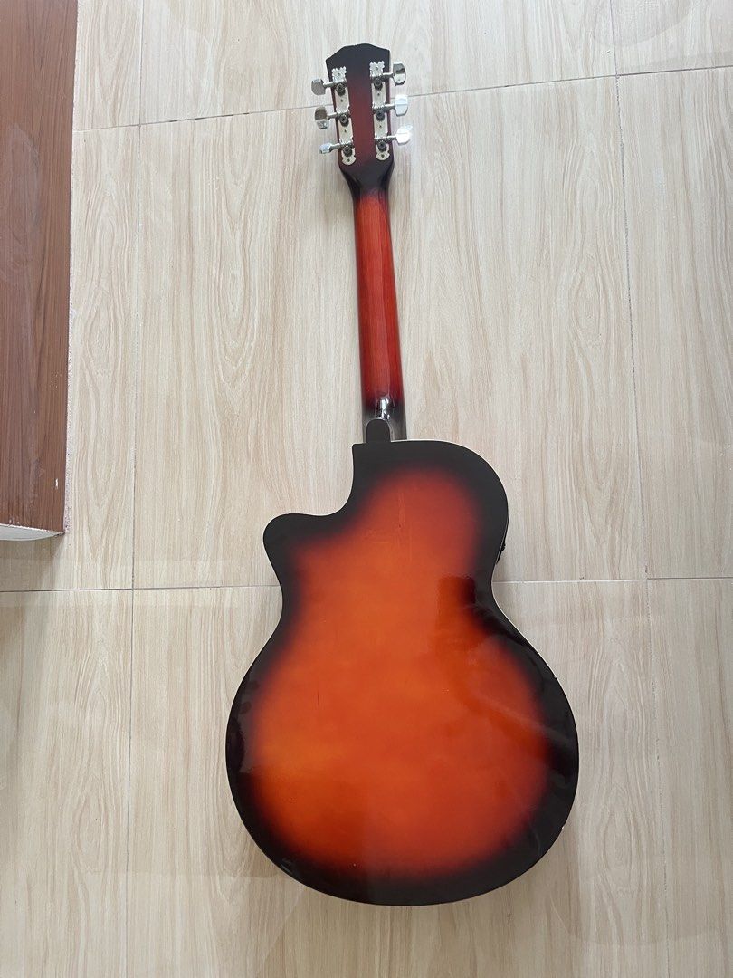 Arena 38C Acoustic Guitar (Category: Musical Instruments) located in Tanza. Submitted by morbita (Listing ID 1465594531, Image 3). Description: Arena 38C Jumbo Cut-Away Acoustic Guitar - Size: 38 Model: AG-38C - Too: Solid Basswood - Fingerboard : Rosewood - Bridge: Rosewood - Fret: 21 - Machine head: covered type - brown glossy finish - can do video condition upon request - guitar only and does not include other items - price still negotiable 🧧