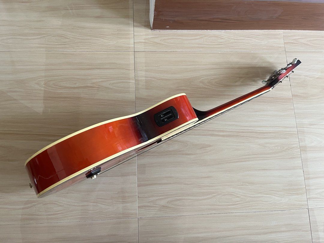 Arena 38C Acoustic Guitar (Category: Musical Instruments) located in Tanza. Submitted by morbita (Listing ID 1465594531, Image 2). Description: Arena 38C Jumbo Cut-Away Acoustic Guitar - Size: 38 Model: AG-38C - Too: Solid Basswood - Fingerboard : Rosewood - Bridge: Rosewood - Fret: 21 - Machine head: covered type - brown glossy finish - can do video condition upon request - guitar only and does not include other items - price still negotiable 🧧
