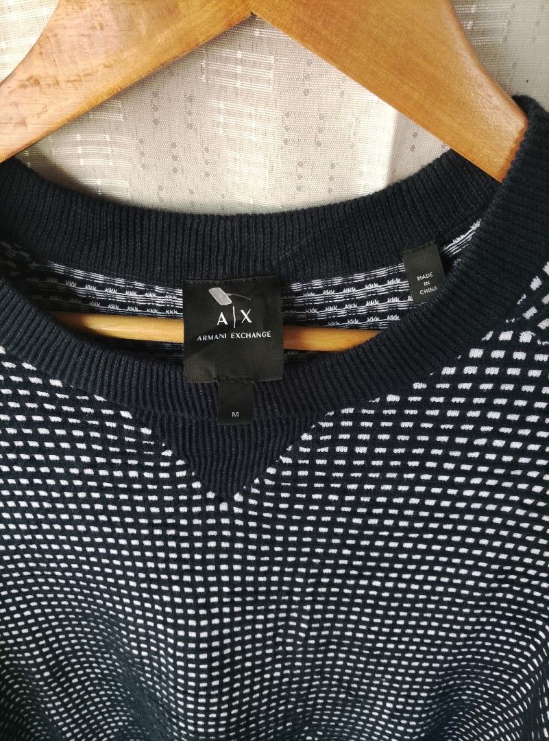 Armani Exchange Black White Pattern Crewneck Sweater Size M (Category: Coats, Jackets and Outerwear) located in Tayum. Submitted by purephoenix.0f7166 (Listing ID 1465633230, Image 3). Description: - Brand: Armani Exchange - 22-23" x 30" dimensions - super smooth and stretch - no issue like new condition - Size: Medium (tag attached) - Color/Pattern: Black and white checked - Material: Textured knit fabric - Design: Ribbed crewneck collar, cuffs,