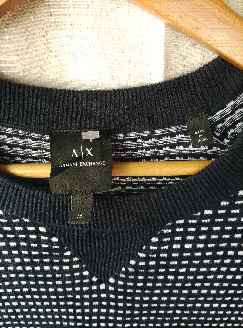 Armani Exchange Black White Pattern Crewneck Sweater Size M (Category: Coats, Jackets and Outerwear) located in Tayum. Submitted by purephoenix.0f7166 (Listing ID 1465633230, Image 2). Description: - Brand: Armani Exchange - 22-23" x 30" dimensions - super smooth and stretch - no issue like new condition - Size: Medium (tag attached) - Color/Pattern: Black and white checked - Material: Textured knit fabric - Design: Ribbed crewneck collar, cuffs,