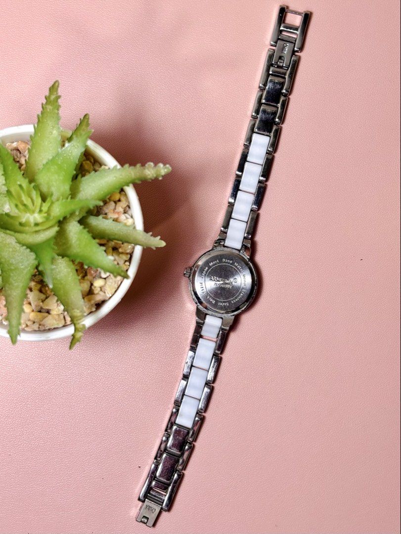 Armitron Ceramic Crystal Watch 75/3919SV (Category: Women's Watches) located in Sorsogon. Submitted by mascarinli36387 (Listing ID 1465587167, Image 2). Description: - Brand: Armitron (Model: 75/3919SV) - Color: White ceramic links with silver-tone hardware - Dial: Round with Roman numerals at 12, 3, 6, and 9 - Details: Bezel studded with sparkling clear crystals - Movement: Reliable Japan quartz with stainless steel case back - Fit: Slim bracele