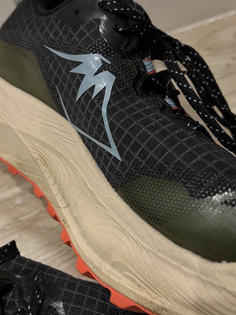 Asics Trabuco Max 3 Trail Running Shoes (Category: Sneakers) located in Bacoor. Submitted by jyano (Listing ID 1465681774, Image 2). Description: Asics Trabuco Max 3 trail running shoes in black and olive green. FF Blast+ cushioned midsole in cream color with bright orange lugged outsoles for traction. Ripstop grid mesh upper with speed lacing system and reflective details. Rear pull tabs attached. Outsoles show minimal dirt from short test runs.
