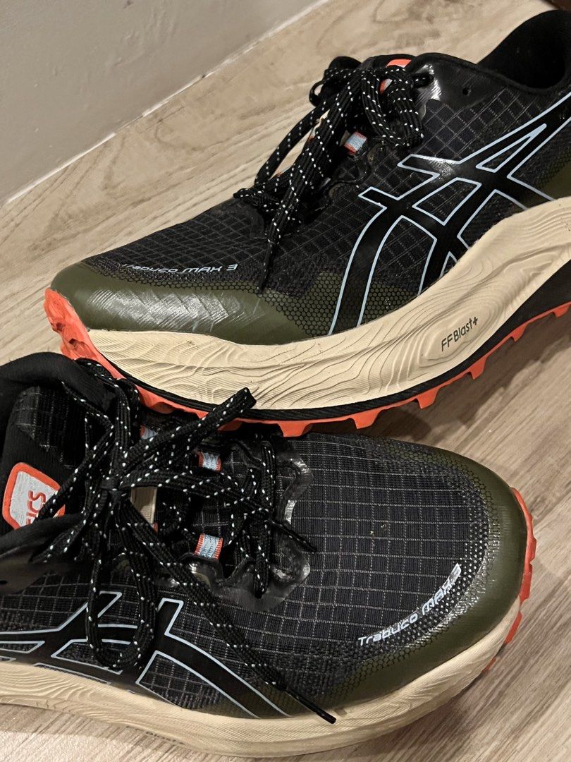 Asics Trabuco Max 3 Trail Running Shoes (Category: Sneakers) located in Bacoor. Submitted by jyano (Listing ID 1465681774, Image 1). Description: Asics Trabuco Max 3 trail running shoes in black and olive green. FF Blast+ cushioned midsole in cream color with bright orange lugged outsoles for traction. Ripstop grid mesh upper with speed lacing system and reflective details. Rear pull tabs attached. Outsoles show minimal dirt from short test runs.