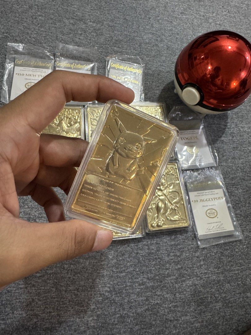 Assorted characters (Category: Raw Singles) located in Puerto Princesa. Submitted by twentythrifts.apparel (Listing ID 1465624200, Image 3). Description: - Set of 6 stunning 23 karat gold-plated Pokémon trading cards - Features fan favorites: Pikachu, Mewtwo, Jigglypuff, Poliwhirl, and Togepi - Each card is sealed in a protective acrylic case - Includes original Certificate of Authenticity for every card - Comes in a collectible red Pokéball cont
