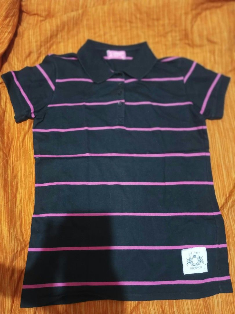 Assorted Polo Shirts Bundle (Category: Shirts) located in Manila. Submitted by raizel1997 (Listing ID 1465592144, Image 2). Description: 5 polo shirts in different colors and patterns. Includes blue with white dots, black with pink stripes, solid green, green with white stripes, and pink with a white moose logo. Short sleeves, standard collars, button-up fronts. Assorted brands like Herbench and Bobson. Comfortable everyday casual wear. Easy to m