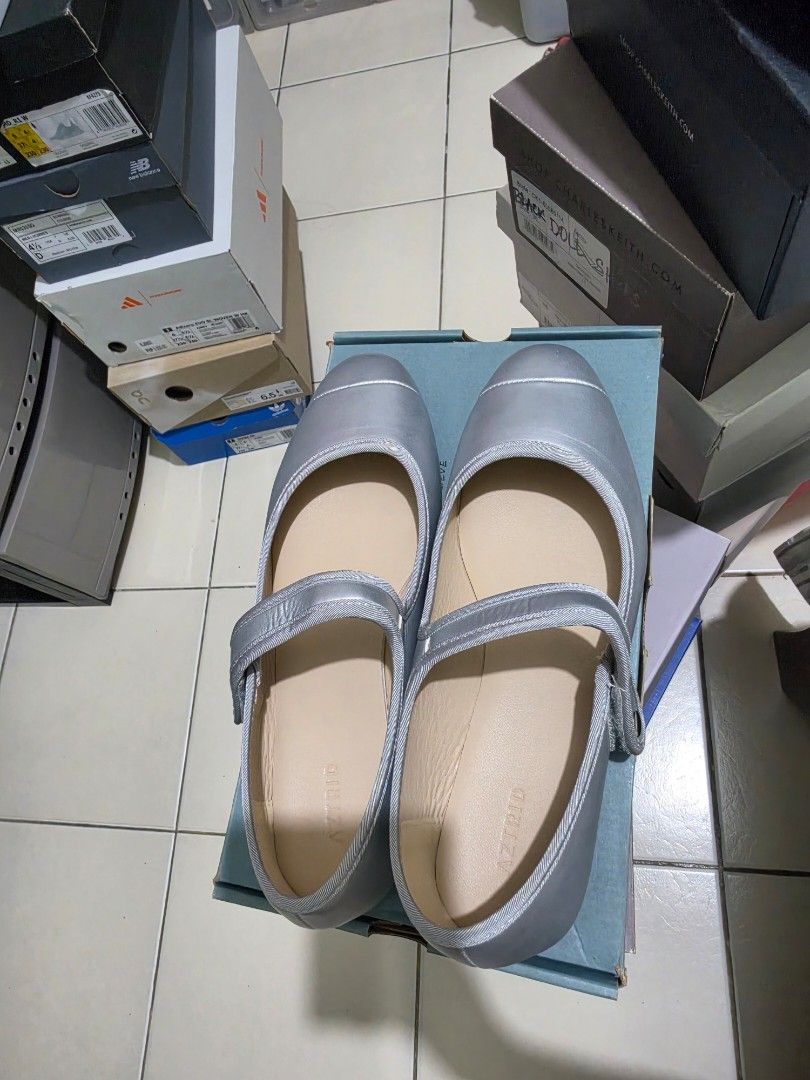 ASTRID Silver Mary Jane Flats (Category: Flats & Sandals) located in Pasig City. Submitted by cheribomb85 (Listing ID 1465755683, Image 1). Description: - Style: Silver Mary Jane flats with pointed toe - Closure: Easy-to-use ankle strap with Velcro - Details: Clean beige inner lining with Astrid branding - Packaging: Comes with original For One Another shoebox - Condition: Excellent, simple, and easy to slip on.