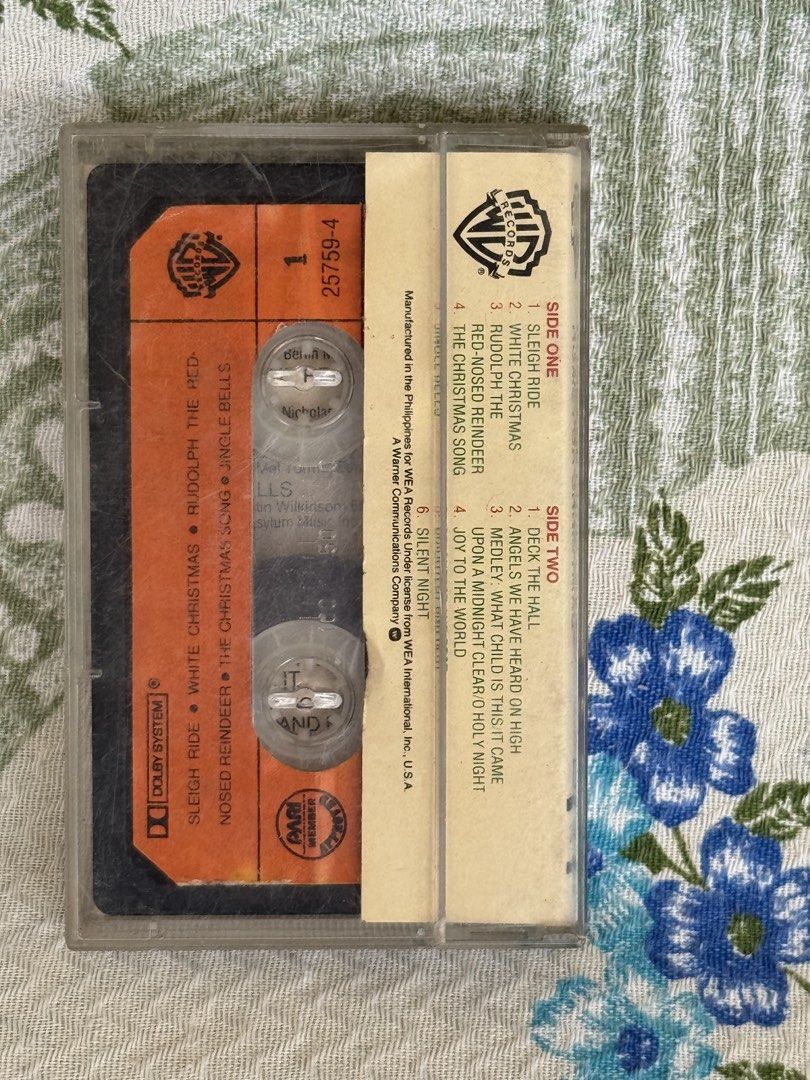 A-Strings - Home for Christmas Cassette Tape (Category: CDs & DVDs) located in San Juan City. Submitted by redgecollection (Listing ID 1465650576, Image 2). Description: - Title: Home for Christmas by A-Strings - Format: Vintage Cassette Tape (Orange and black shell with clear case) - Catalog Number: 25759-4 - Manufacturer: WEA Records (Philippines) - Tracklist Highlights: Sleigh Ride, White Christmas, Jingle Bells, and Silent Night - Condition: 