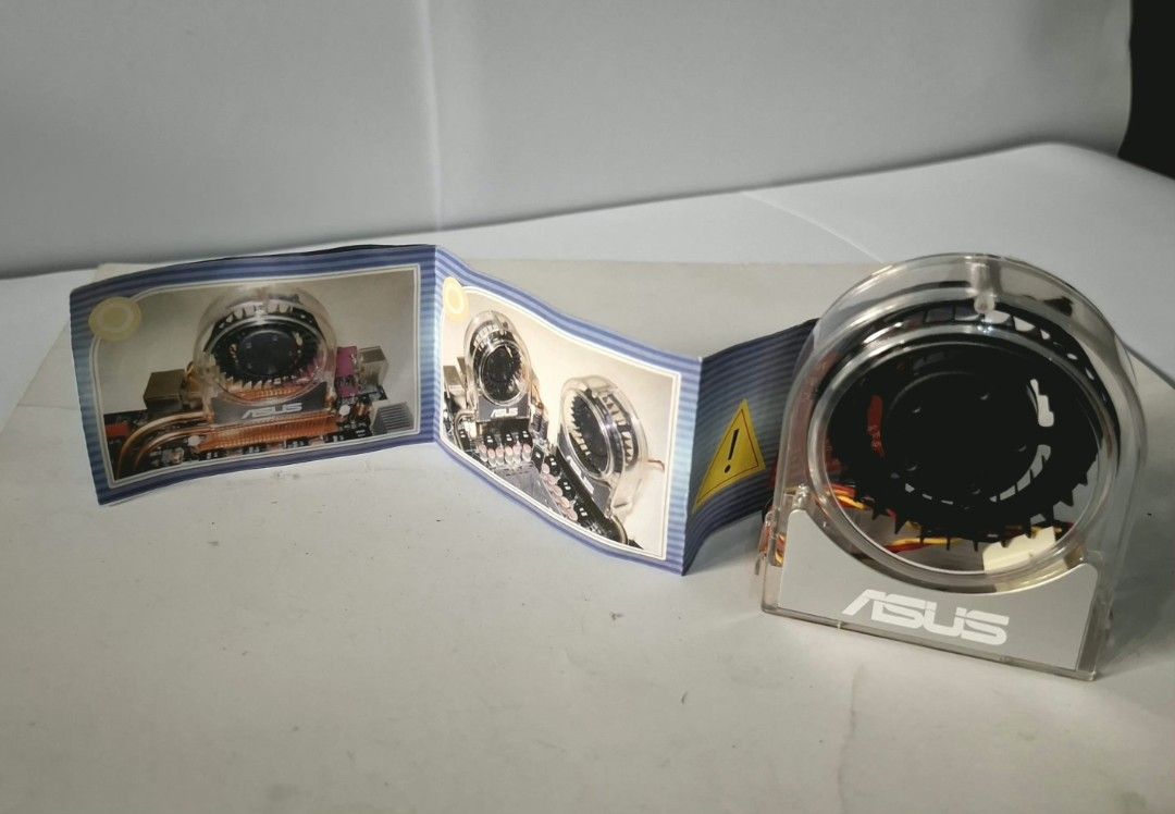 ASUS OPTIONAL FAN (Category: Other Accessories) located in Quezon City. Submitted by masterv26 (Listing ID 1465688997, Image 2). Description: This is an original ASUS optional motherboard centrifugal blower/turbine cooling fan (commonly used on enthusiast-grade legacy motherboards like the ASUS X48 and X58 series, such as the P6X58D Premium or Maximus/Formula boards). It features a clear/transparent plastic housing with the ASUS logo, a 3-pin con