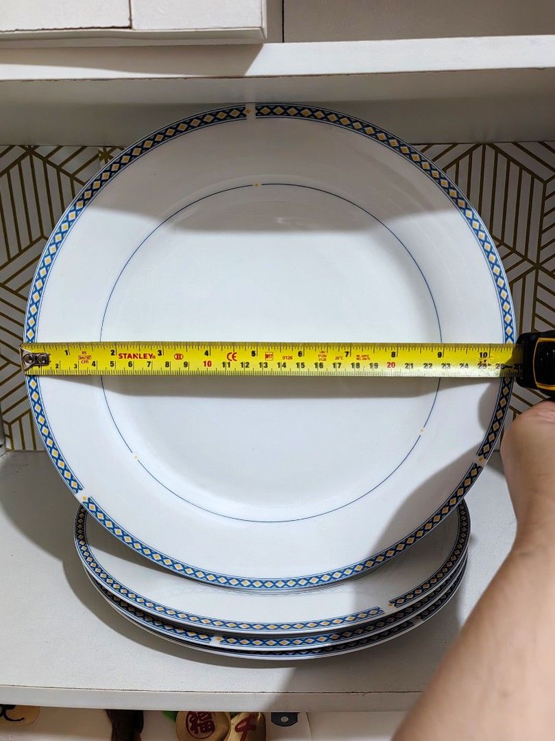 Athena Fine Porcelain Cup and Plate Dinnerware Set (Category: Dinnerware & Cutlery) located in San Jose del Monte. Submitted by chimkenugets (Listing ID 1465688510, Image 3). Description: Athena Fine Porcelain dinnerware in white with a blue and yellow lattice border and thin blue accent line. Microwave and dishwasher safe Set includes: 4 dinner plates, approx. 10.5 in / 27 cm 3 saucers / side plates 1 cup , approx. 3.5 in / 9 cm across the rim C