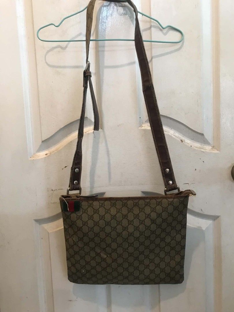 Auth Vintage Gucci Web Stripe sling Bag (PROJECT) (Category: Cross-body Bags) located in Midsayap. Submitted by purse_gedo (Listing ID 1465610437, Image 1). Description: - Brand: Gucci Vintage - Material: Classic GG Monogram Canvas with Brown Leather Trim - Design: Iconic Green & Red Web Stripe Accent - Closure & Strap: Zip Top Closure with Adjustable Leather Strap - Interior: Canvas Lining with Slip Pocket & Leather Brand Patch - Condition: Heav