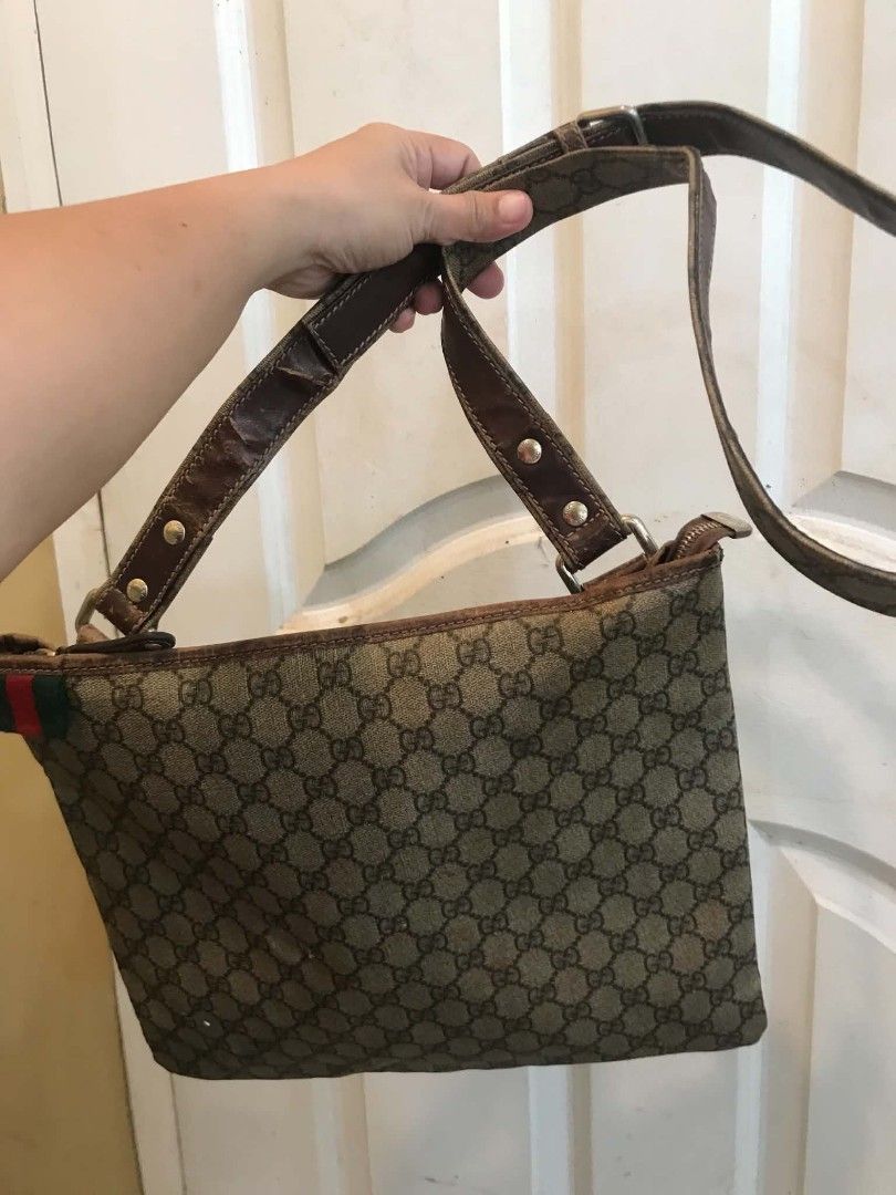 Auth Vintage Gucci Web Stripe sling Bag (PROJECT) (Category: Cross-body Bags) located in Midsayap. Submitted by purse_gedo (Listing ID 1465610437, Image 2). Description: - Brand: Gucci Vintage - Material: Classic GG Monogram Canvas with Brown Leather Trim - Design: Iconic Green & Red Web Stripe Accent - Closure & Strap: Zip Top Closure with Adjustable Leather Strap - Interior: Canvas Lining with Slip Pocket & Leather Brand Patch - Condition: Heav