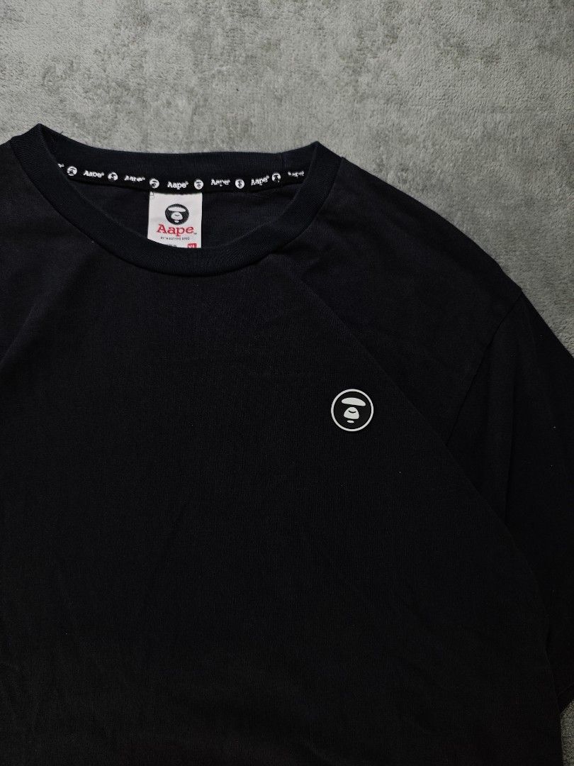 Authentic Aape Now Chest Logo Slitted Black Tee (Authentic/Legit) (Category: Tshirts & Polo Shirts ) located in San Pedro. Submitted by chronothrift (Listing ID 1465652293, Image 2). Description: - Size: Large (W22 x 27-29L) - Condition: 9.2/10 - Color Rate: 9.1/10 - Flaws: ❌❌❌ (None) MOD: J&T Express / Lalamove / Meet MOP: Gcash / Bank Transfer.
