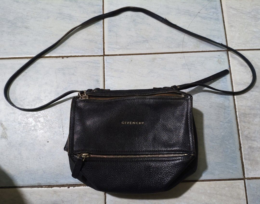 Authentic Givenchy black goatskin leather pandora small (Category: Luxury Bags & Wallets) located in Puerto Princesa. Submitted by lotsstuff (Listing ID 1465648153, Image 1). Description: Measurements: 10.5" L x 5.5" W x 6.5" H Interior Pockets: Single zip pocket, one flat pocket, one cell phone pocket Exterior Pockets: One zip pocket Handles: Single rolled leather top handle and long leather strap Handle Drop: 7", 23" In good condition issue use