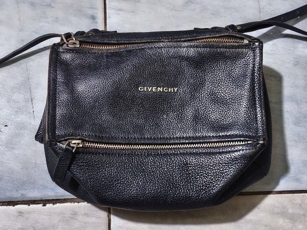 Authentic Givenchy black goatskin leather pandora small (Category: Luxury Bags & Wallets) located in Puerto Princesa. Submitted by lotsstuff (Listing ID 1465648153, Image 2). Description: Measurements: 10.5" L x 5.5" W x 6.5" H Interior Pockets: Single zip pocket, one flat pocket, one cell phone pocket Exterior Pockets: One zip pocket Handles: Single rolled leather top handle and long leather strap Handle Drop: 7", 23" In good condition issue use