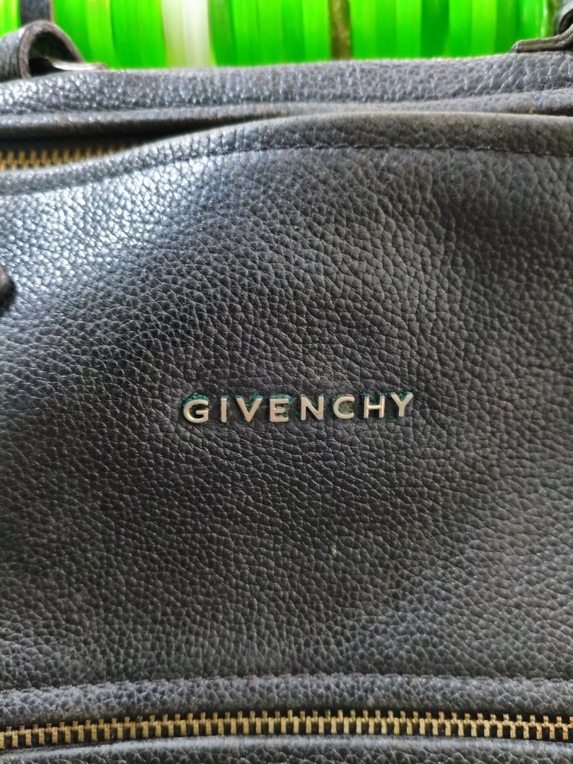 Authentic Givenchy black goatskin leather pandora small (Category: Luxury Bags & Wallets) located in Puerto Princesa. Submitted by lotsstuff (Listing ID 1465648153, Image 3). Description: Measurements: 10.5" L x 5.5" W x 6.5" H Interior Pockets: Single zip pocket, one flat pocket, one cell phone pocket Exterior Pockets: One zip pocket Handles: Single rolled leather top handle and long leather strap Handle Drop: 7", 23" In good condition issue use