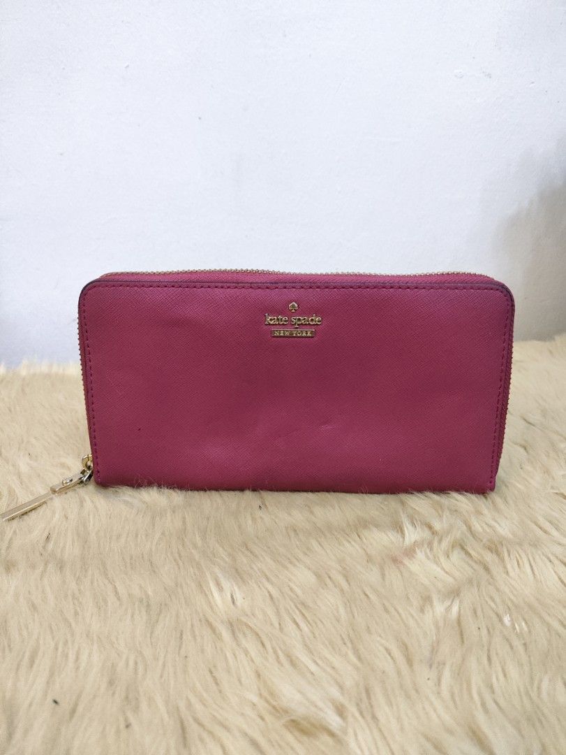 Authentic Kate Spade Lacey zip around long wallet (Category: Wallets & Card holders) located in Rizal. Submitted by hsiri1128 (Listing ID 1465668921, Image 1). Description: 💯✔️Legit CONDITION : 8/10 ISSUE / FLAWS : Normal signs of wear only MATERIAL : Saffiano leather w/ gold hardwares DETAILS : ykk zip. fit promax inside.