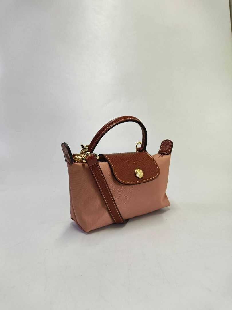 Authentic Longchamp Le Pliage Mini Sling Bag - pink tea (Category: Luxury Bags & Wallets) located in Quezon City. Submitted by hollowwillow (Listing ID 1465628162, Image 2). Description: .