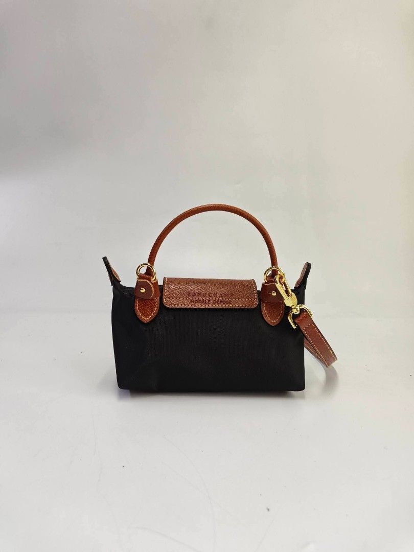 Authentic Longchamp Le Pliage Black Mini Sling Bag (Category: Luxury Bags & Wallets) located in Quezon City. Submitted by hollowwillow (Listing ID 1465639326, Image 3). Description: .