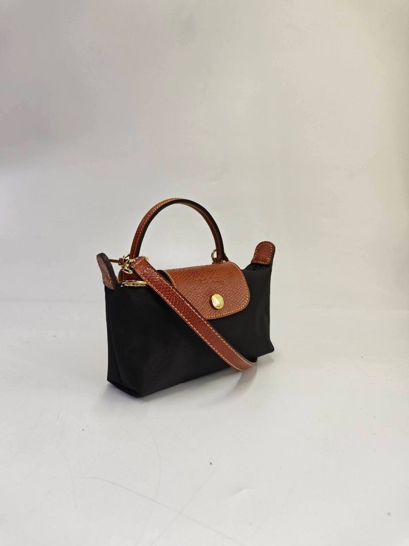 Authentic Longchamp Le Pliage Black Mini Sling Bag (Category: Luxury Bags & Wallets) located in Quezon City. Submitted by hollowwillow (Listing ID 1465639326, Image 2). Description: .