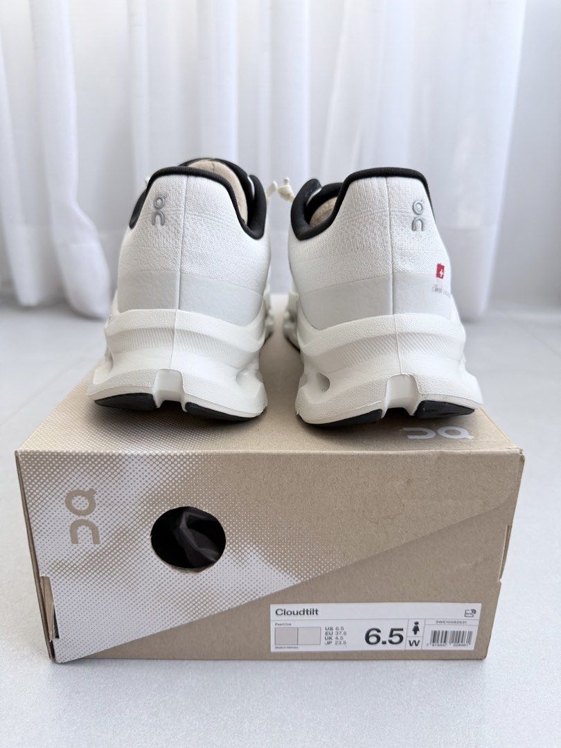 Authentic On Running Cloudtilt Pearl Ice Size US 6.5W (Category: Sneakers) located in San Fernando. Submitted by lovepreloved13 (Listing ID 1465589522, Image 3). Description: - Brand: On Running - Model: Cloudtilt - Colorway: Pearl and Ice (White with black collar lining and Swiss flag heel detail) - Size: Women's US 6.5 / EU 37.5 / UK 4.5 / JP 23.5 - Condition: Like new, with original box - Features: Ultra-lightweight design with Cloudtec Phase 