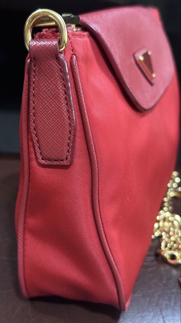 Authentic Prada Nylon Chain Sling Bag (Category: Luxury Bags & Wallets) located in Las Pinas. Submitted by marshmallowmax (Listing ID 1465615800, Image 3). Description: Guaranteed Authentic! Slightly used.. no flaws. With dustbag and cards.