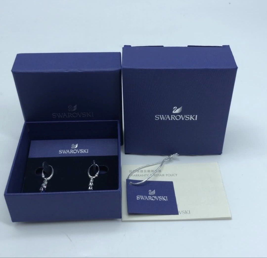 Authentic SWAROVSKI Fashion Dangling Silver Earrings (Category: Luxury Accessories) located in Las Pinas. Submitted by jc_closet (Listing ID 1465589071, Image 1). Description: 💯 Authentic or Money Back Best for Gifts Comes with original box Silver with Blue Crystals Shipping c/o Buyer.