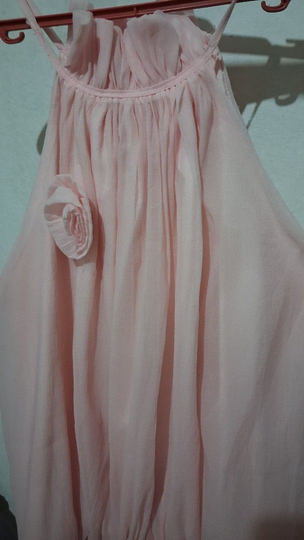B1T1 Dresses Pink and Green (Category: Dresses) located in Manila. Submitted by boldfish_512666 (Listing ID 1465744247, Image 2). Description: - 👗 Item 1: Light pink sleeveless dress - Material: Layered chiffon - Detail: Floral rosette accent near bottom hem - 🌿 Item 2: Olive green ribbed dress - Material: Stretchy textured fabric - Detail: Shoulder straps with ruffled accents.