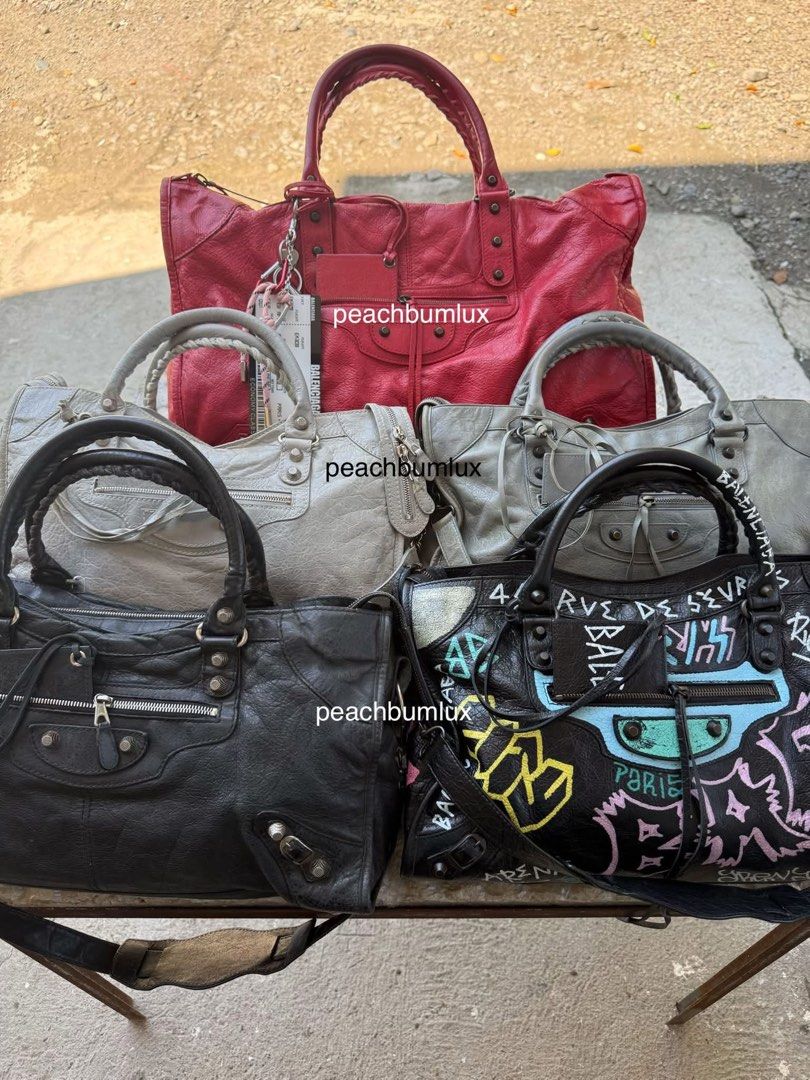 BALENCIAGA WEEKENDER CITY PART TIME (Category: Luxury Bags & Wallets) located in Baguio. Submitted by peachbumapparel (Listing ID 1465631444, Image 1). Description: - Authentic Balenciaga City motorcycle bags available - Colors: Classic Black, Red, Grey, and Limited Graffiti Print - Signature studded hardware and front zip pocket - Double top handles with an effortless, slouchy leather design - Perfect everyday luxury bag - Send a DM to check spe