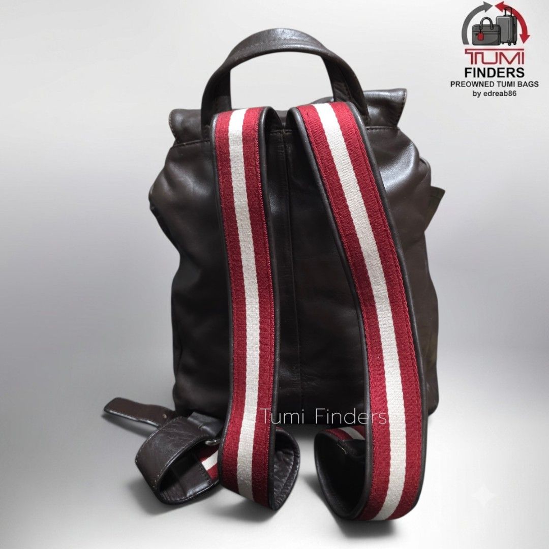 Bally Brown Leather Backpack with Signature Striped Straps (Category: Luxury Bags & Wallets) located in Cabuyao City. Submitted by swiftdeer.ed9787 (Listing ID 1465716184, Image 3). Description: FOR SALE Preloved Bally Backpack pure leather PRICE: 5500 LOCATION: CABUYAO LAGUNA - Authentic Bally backpack in rich brown leather - Flap top closure with secure drawstring and front zip pocket - Iconic red and white striped canvas shoulder straps - Conv
