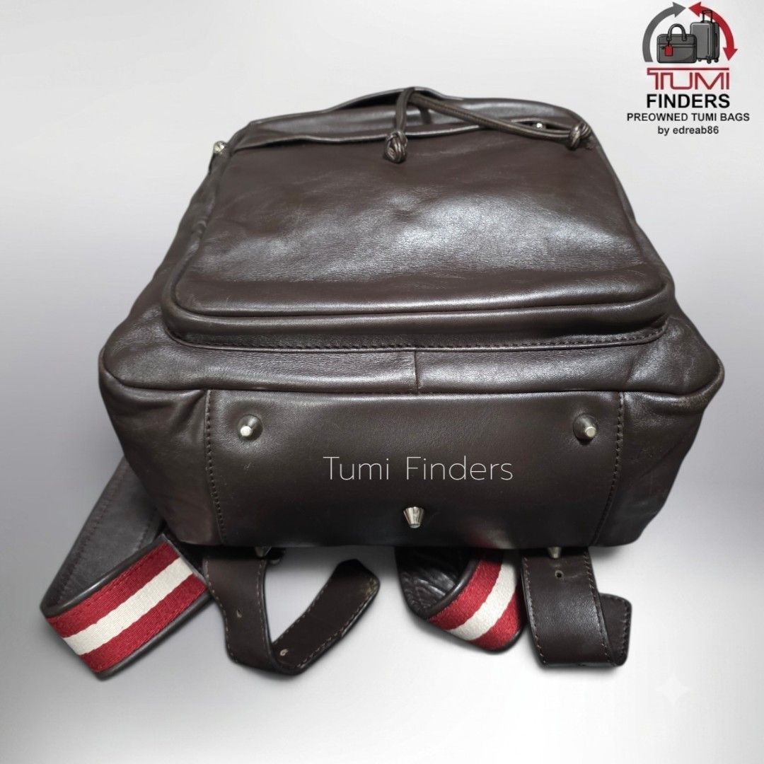 Bally Brown Leather Backpack with Signature Striped Straps (Category: Luxury Bags & Wallets) located in Cabuyao City. Submitted by swiftdeer.ed9787 (Listing ID 1465716184, Image 2). Description: FOR SALE Preloved Bally Backpack pure leather PRICE: 5500 LOCATION: CABUYAO LAGUNA - Authentic Bally backpack in rich brown leather - Flap top closure with secure drawstring and front zip pocket - Iconic red and white striped canvas shoulder straps - Conv