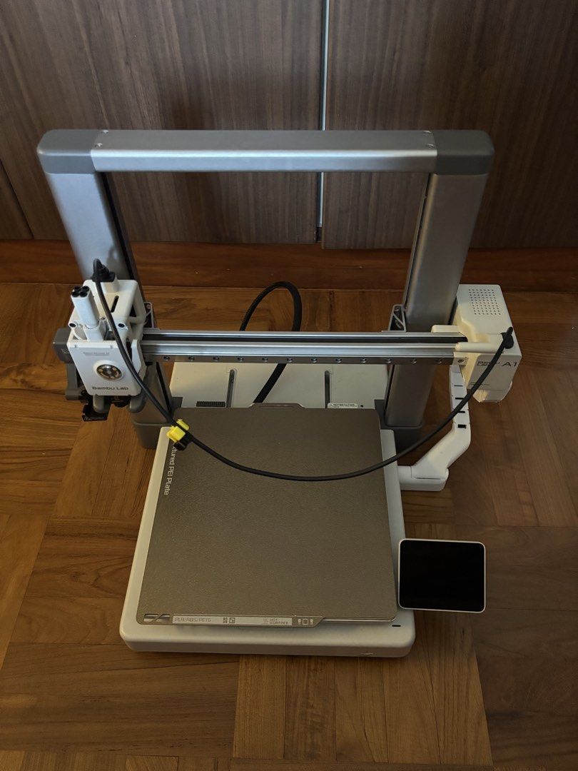 Bambu Lab A1 3D Printer (Category: Printers, Scanners & Copiers) located in Singapore. Submitted by dannylu569 (Listing ID 1465668317, Image 1). Description: - Model: Bambu Lab A1 3D printer - Includes: Textured PEI build plate and control screen - Design: Compact gantry setup in clean white/grey housing - Ideal for: Rapid prototyping and hobby printing tasks - Fulfillment: Local pickup or message to arrange delivery.