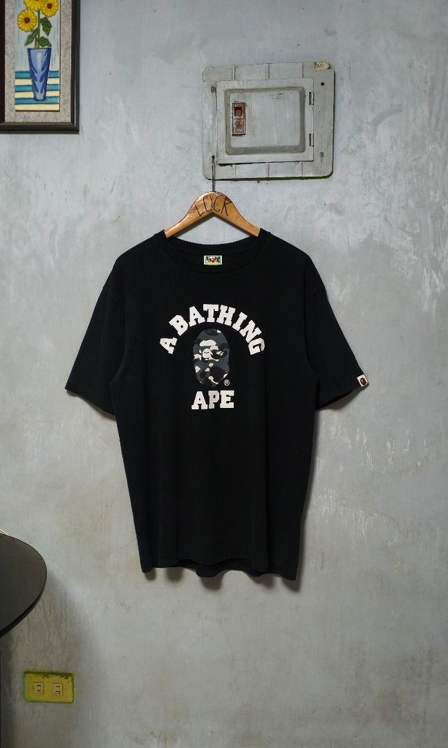 BAPE COLLEGE TEE ( AUTHENTIC ) (Category: Tshirts & Polo Shirts ) located in Calamba. Submitted by luckthriftph (Listing ID 1465647143, Image 1). Description: BAPE COLLEGE TEE *AUTHENTIC Color rate: 9.5/10 Width: 23 Length: 29 Excellent Condition Issue: Super minimal hairline and minimal fade sa underarm *Money back guarantee if proven fake Mine: 1999 Loc: Calamba, Laguna Courier: JNT, Lalamove and LBC ( Cop Only ) DM ME TO PURCHASE! 📩.