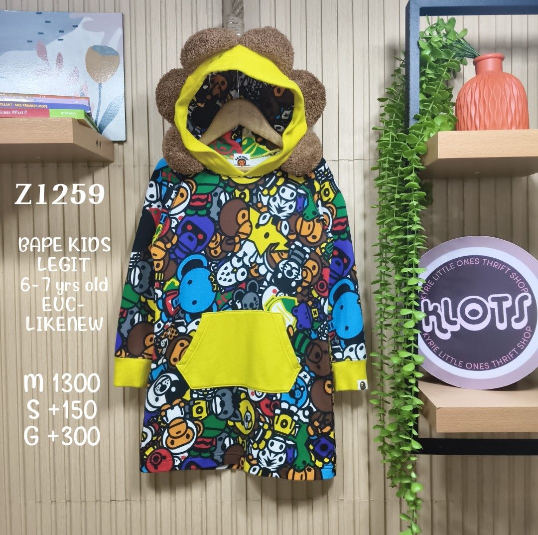 BAPE Kids (Category: Babies & Kids Fashion) located in Quezon City. Submitted by christinejoycheng1 (Listing ID 1465737487, Image 1). Description: - Authentic BAPE Kids multi-color animal print hoodie dress - Features a vibrant all-over graphic pattern with iconic characters, yellow ribbed cuffs and front pocket - Size: Tagged 120 (best fits 6-7 years old).