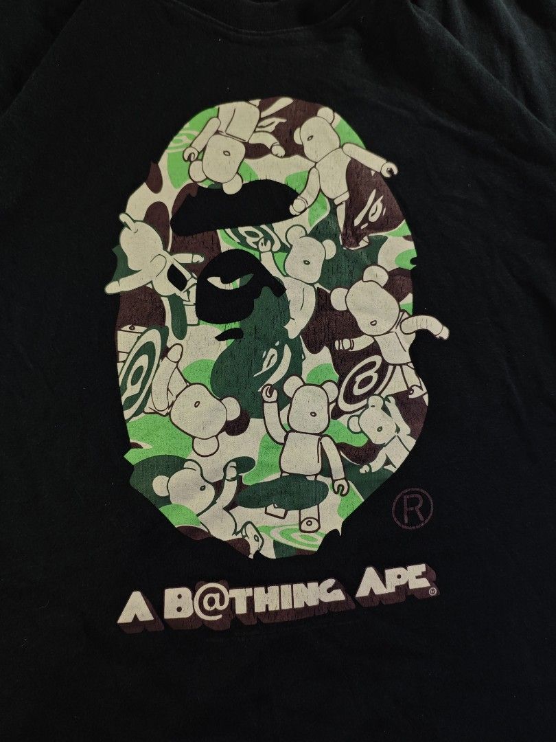 Bape x Bear Brick Camou Black Tee (Category: Tshirts & Polo Shirts ) located in San Pedro. Submitted by chronothrift (Listing ID 1465652443, Image 2). Description: - Size: XL (W23 x 29L) - Condition: 8/10 - Color Rate: 8/10 - Flaws: Hairline Cracks / Fade MOD: J&T Express / Lalamove / Meetups MOP: Gcash / Bank Transfer.