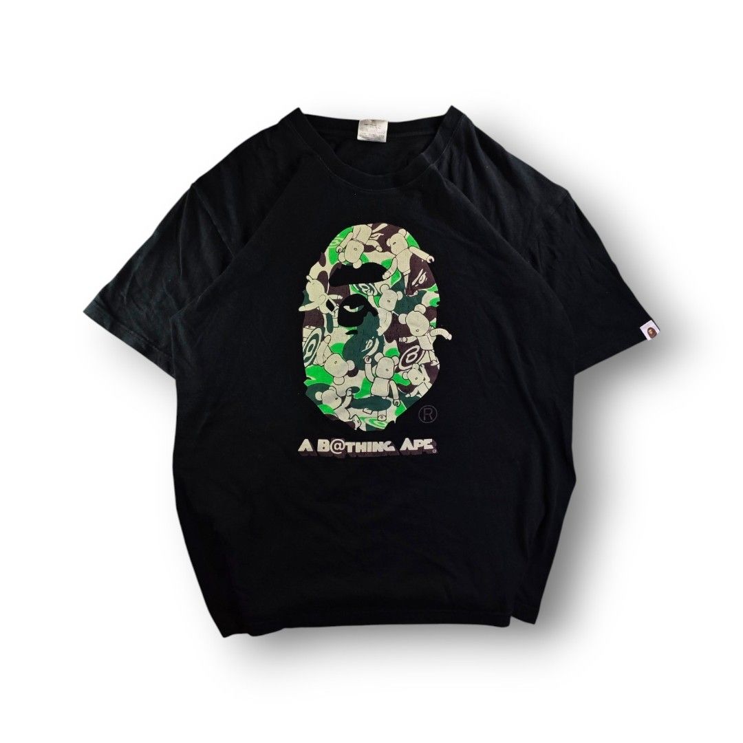 Bape x Bear Brick Camou Black Tee (Category: Tshirts & Polo Shirts ) located in San Pedro. Submitted by chronothrift (Listing ID 1465652443, Image 1). Description: - Size: XL (W23 x 29L) - Condition: 8/10 - Color Rate: 8/10 - Flaws: Hairline Cracks / Fade MOD: J&T Express / Lalamove / Meetups MOP: Gcash / Bank Transfer.