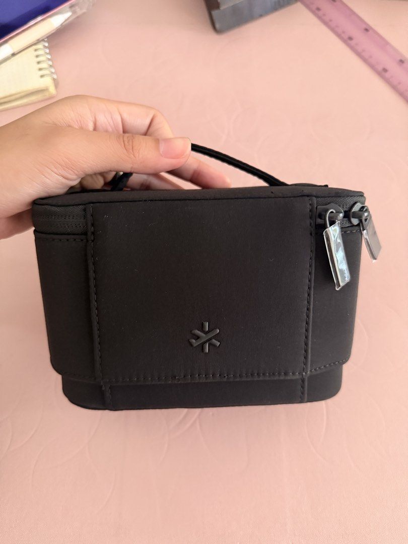 BASH Mini Flex Organizr (Category: Accessory Holder, Box & Organizers) located in Manila. Submitted by jdees_ (Listing ID 1465586830, Image 3). Description: - Brand: BASH (Good as new) bought last month only - Color: Carbon (Black) - Design: Structured rectangular shape with a convenient top handle and secure double zippers - Details: Debossed BASH logo plaque on the front and a minimal symbol on the back - Material: Sturdy fabric construction bu