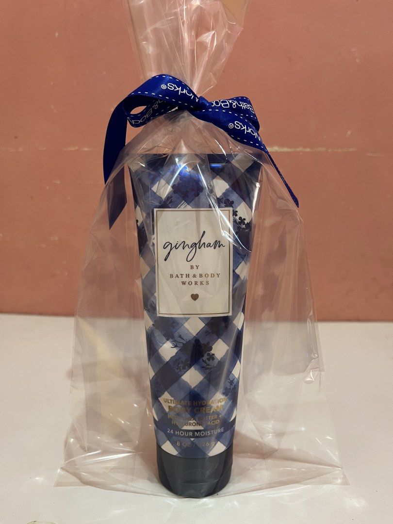 Bath & Body Works Gingham Ultimate Hydration Body Cream (Category: Body Care) located in Mabalacat. Submitted by padeclutter (Listing ID 1465618115, Image 1). Description: - Brand: Bath & Body Works - Scent: Gingham - Size: 8 oz / 226 g - Formula: Ultimate hydration with shea butter and hyaluronic acid for 24-hour moisture - Condition: Brand new, unopened, and unused - Packaging: Comes pre-wrapped in clear plastic with a blue Bath & Body Works ri