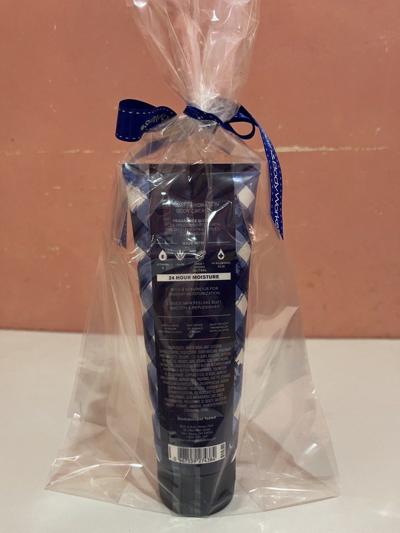 Bath & Body Works Gingham Ultimate Hydration Body Cream (Category: Body Care) located in Mabalacat. Submitted by padeclutter (Listing ID 1465618115, Image 2). Description: - Brand: Bath & Body Works - Scent: Gingham - Size: 8 oz / 226 g - Formula: Ultimate hydration with shea butter and hyaluronic acid for 24-hour moisture - Condition: Brand new, unopened, and unused - Packaging: Comes pre-wrapped in clear plastic with a blue Bath & Body Works ri