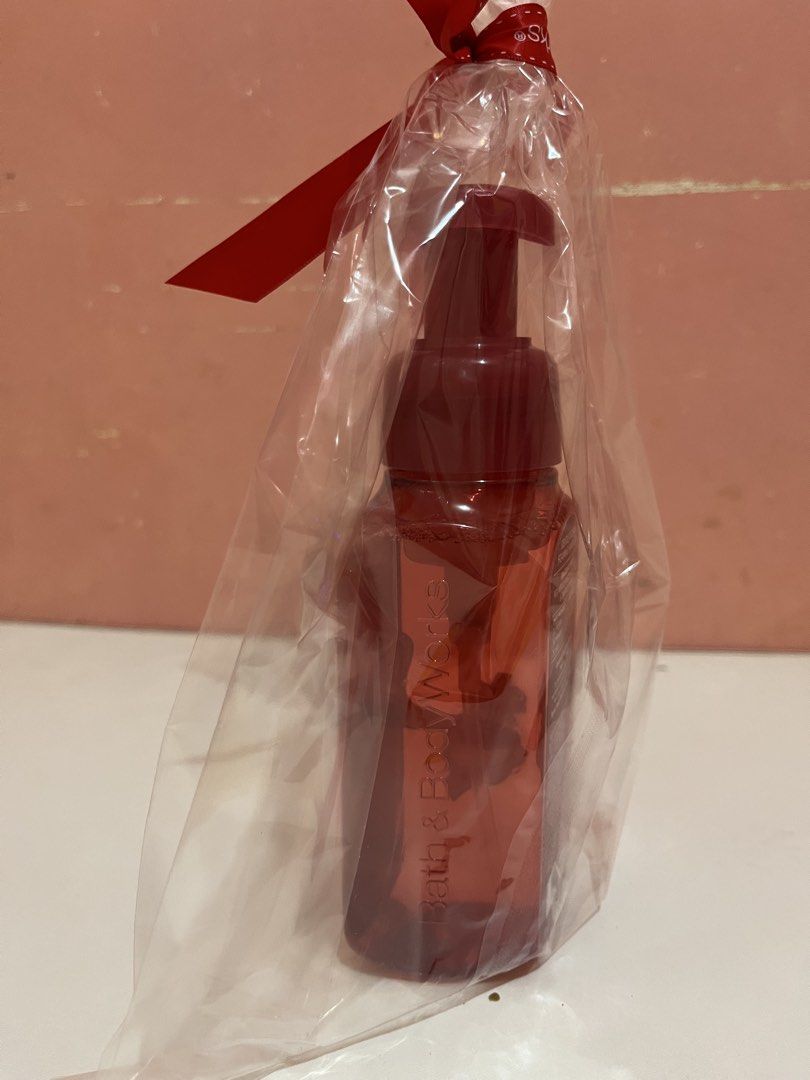 Bath & Body Works Winter Candy Apple Foaming Hand Soap (Category: Hands & Nails) located in Mabalacat. Submitted by padeclutter (Listing ID 1465617902, Image 3). Description: - Brand: Bath & Body Works - Product: Winter Candy Apple Gentle & Clean Foaming Hand Soap - Size: 8.75 fl oz / 259 ml - Fragrance Notes: Red apples, winter rose petals, and candied oranges - Packaging: Pre-sealed in a clear gift bag with a red ribbon - Perfect ready-to-give 