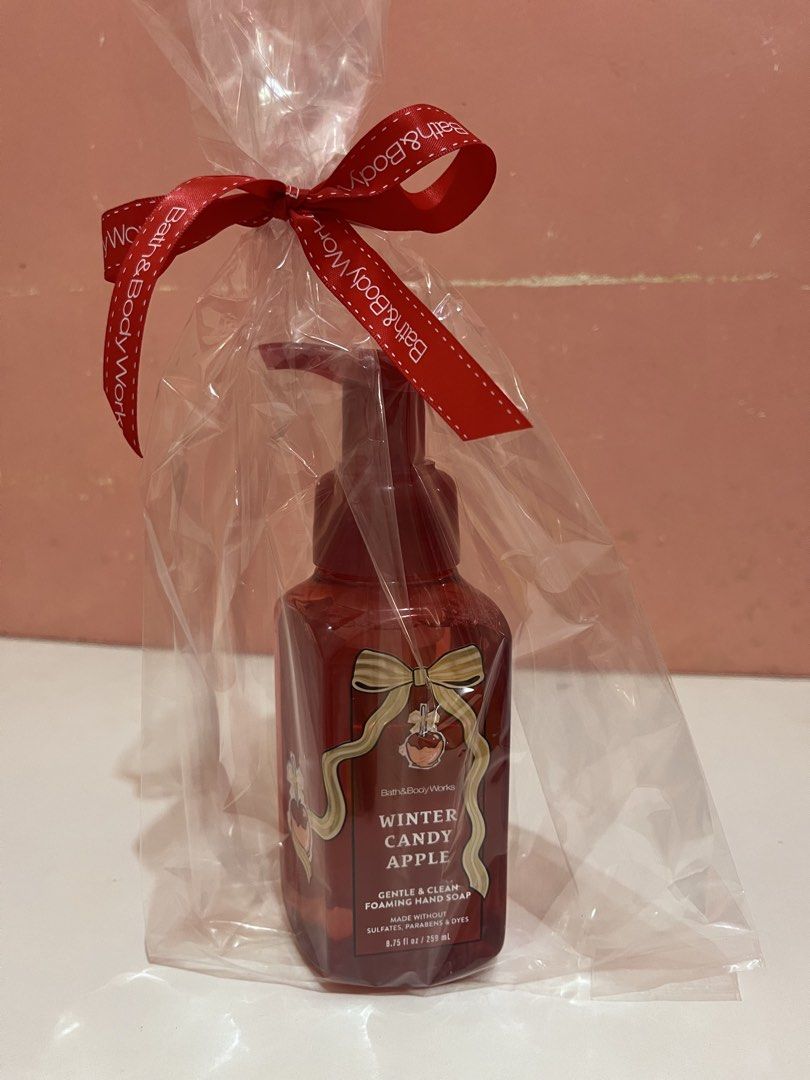 Bath & Body Works Winter Candy Apple Foaming Hand Soap (Category: Hands & Nails) located in Mabalacat. Submitted by padeclutter (Listing ID 1465617902, Image 1). Description: - Brand: Bath & Body Works - Product: Winter Candy Apple Gentle & Clean Foaming Hand Soap - Size: 8.75 fl oz / 259 ml - Fragrance Notes: Red apples, winter rose petals, and candied oranges - Packaging: Pre-sealed in a clear gift bag with a red ribbon - Perfect ready-to-give 