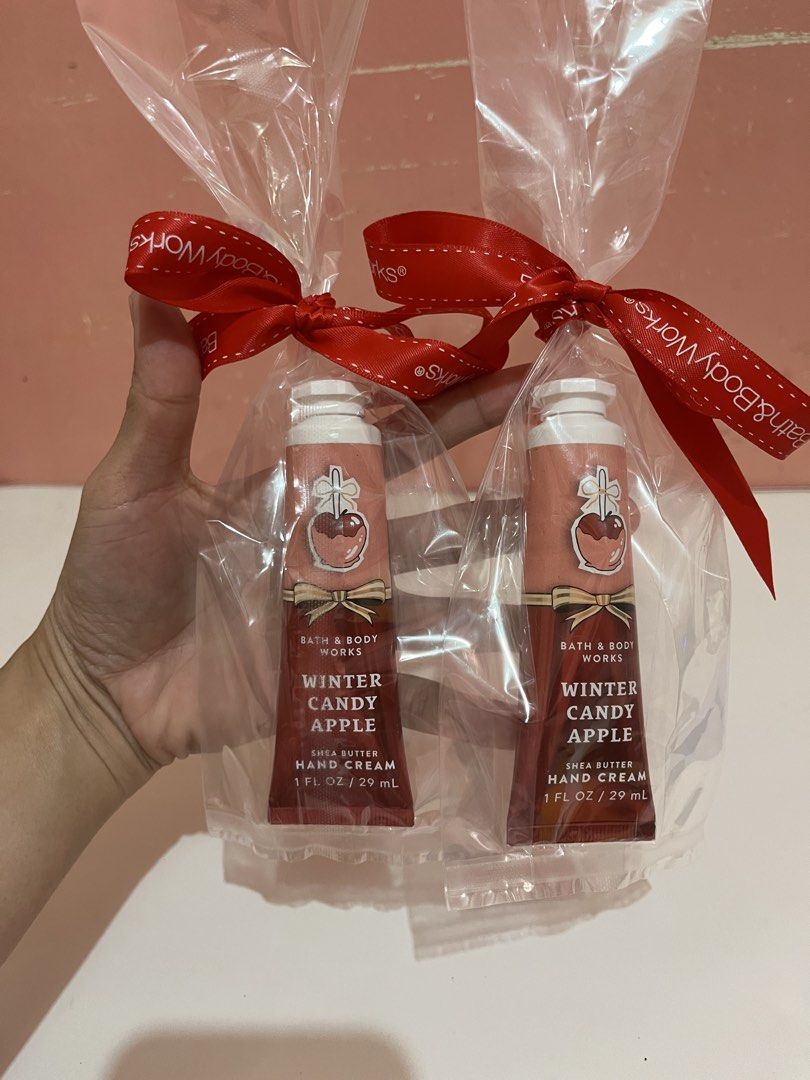 Bath & Body Works Winter Candy Apple Hand Cream Set (Category: Body Care) located in Mabalacat. Submitted by padeclutter (Listing ID 1465618318, Image 1). Description: - Includes 2 tubes of Bath & Body Works Winter Candy Apple hand cream (1 fl oz / 29 ml each) - Rich shea butter formula to keep hands soft and moisturized - Individually packed in clear plastic bags with festive red ribbons - Perfect for gifts, party favors, or your daily bag - 100