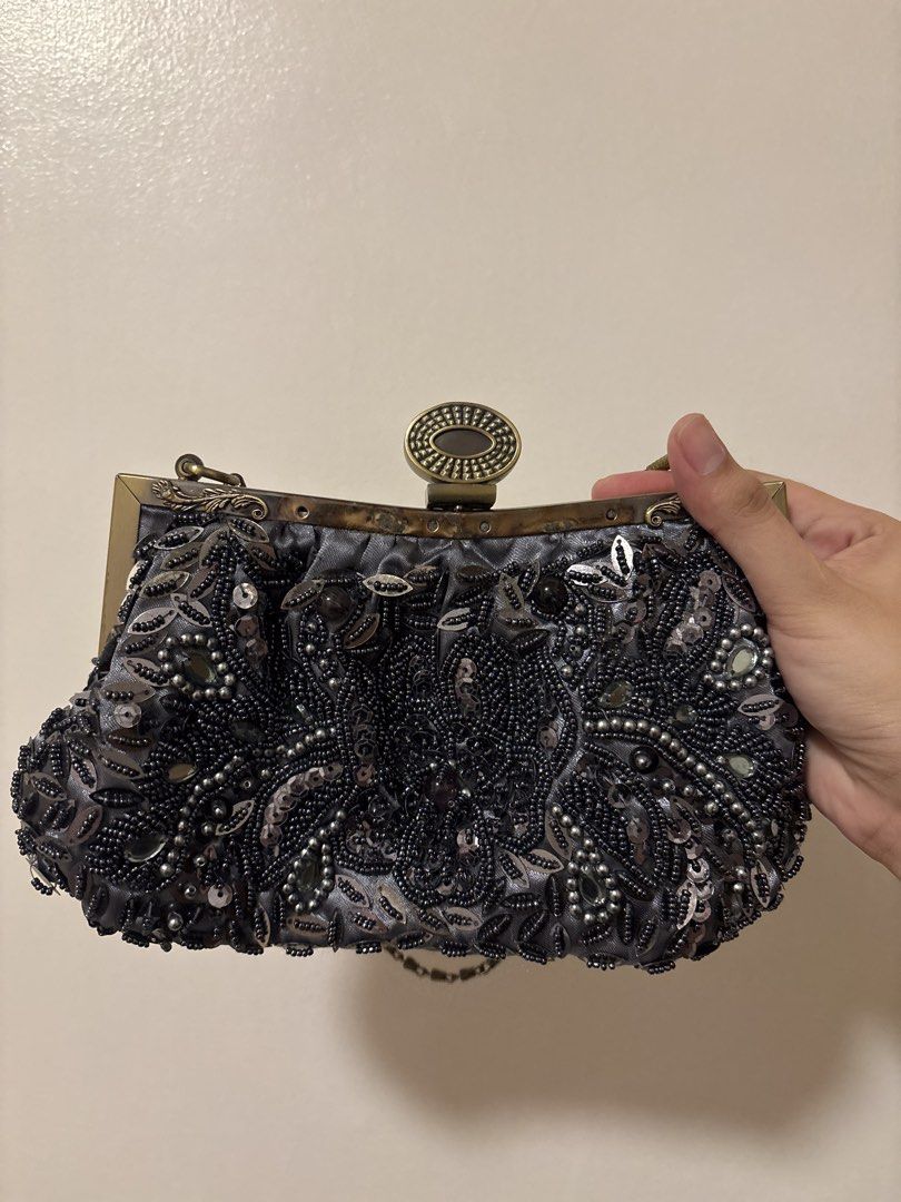 Beaded Evening Clutch Purse with Chain Strap (Category: Clutches) located in Manila. Submitted by dalampasiganswim (Listing ID 1465645322, Image 1). Description: - Elegant grey satin evening clutch covered in intricate black bead and sequin floral patterns - Secure antique brass-tone metal frame with a classic clasp lock closure - Versatile design featuring a detachable chain shoulder strap for hand-held or crossbody use - Fully fabric-lined inte