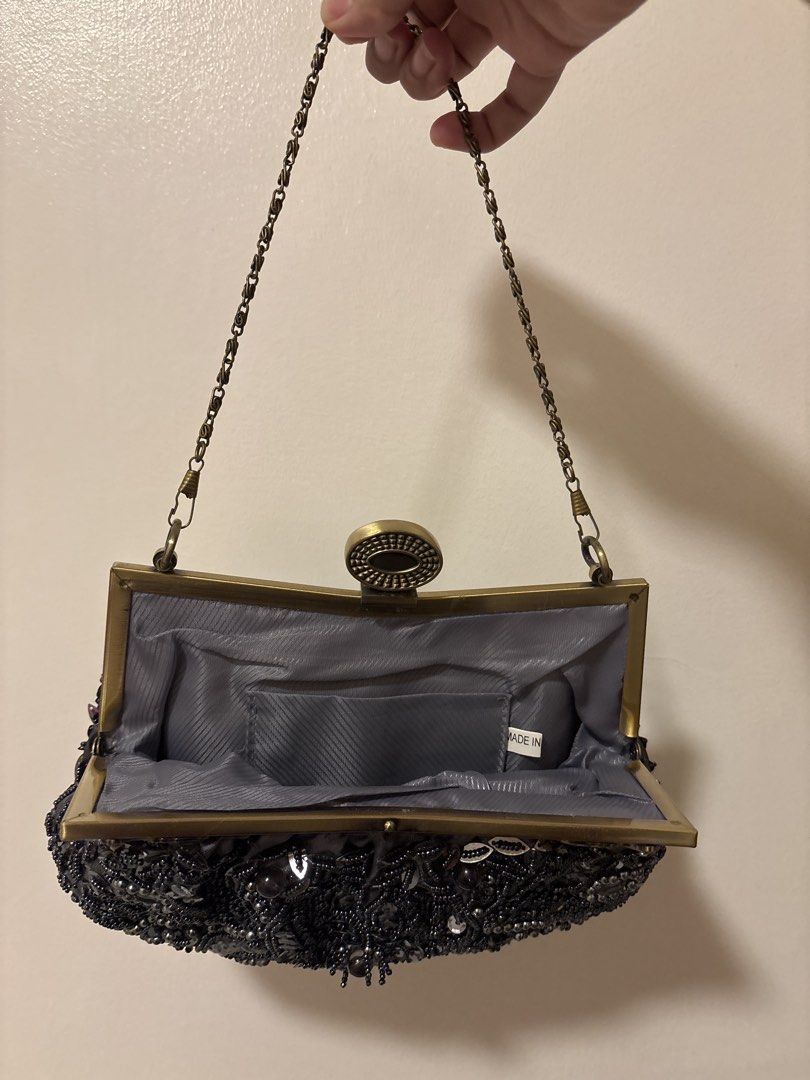 Beaded Evening Clutch Purse with Chain Strap (Category: Clutches) located in Manila. Submitted by dalampasiganswim (Listing ID 1465645322, Image 2). Description: - Elegant grey satin evening clutch covered in intricate black bead and sequin floral patterns - Secure antique brass-tone metal frame with a classic clasp lock closure - Versatile design featuring a detachable chain shoulder strap for hand-held or crossbody use - Fully fabric-lined inte