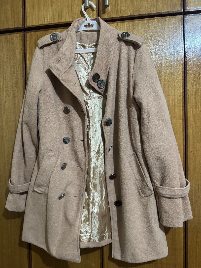 Beige Double-Breasted Wool Trench Coat with Satin Lining (Category: Coats, Jackets and Outerwear) located in Santa Cruz, Pampanga. Submitted by eygee_rp (Listing ID 1465725806, Image 1). Description: - Color: Classic Beige - Style: Double-breasted midi coat with structured silhouette - Details: Lapel collar, button front, decorative shoulder flaps, and belted cuffs - Pockets: Deep side pockets for functionality - Lining: Premium glossy champagne-