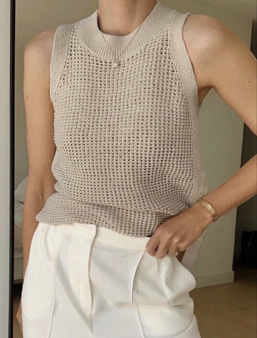 Beige Knit Sleeveless Vest (Category: Sleeveless) located in Pasig City. Submitted by jnzmrq1003 (Listing ID 1461361319, Image 1). Description: - Lightweight knit vest - Neutral beige color - Sleeveless design - Ribbed neckline and hem - Open knit pattern for texture - Ideal for layering over shirts or dresses - Versatile for casual or dressed-up looks.