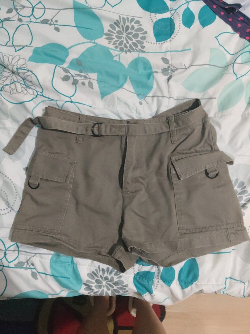 Bench olive green cargo shorts (Category: Shorts) located in Rizal. Submitted by anyadrea (Listing ID 1465667735, Image 1). Description: - Brand: Bench - Color: Olive green - Size: Medium (tag inside waistband) - Style: Casual everyday staple - Material: Simple cotton fabric - Features: Standard button and zip fly construction - Shipping: Ready for quick shipping.