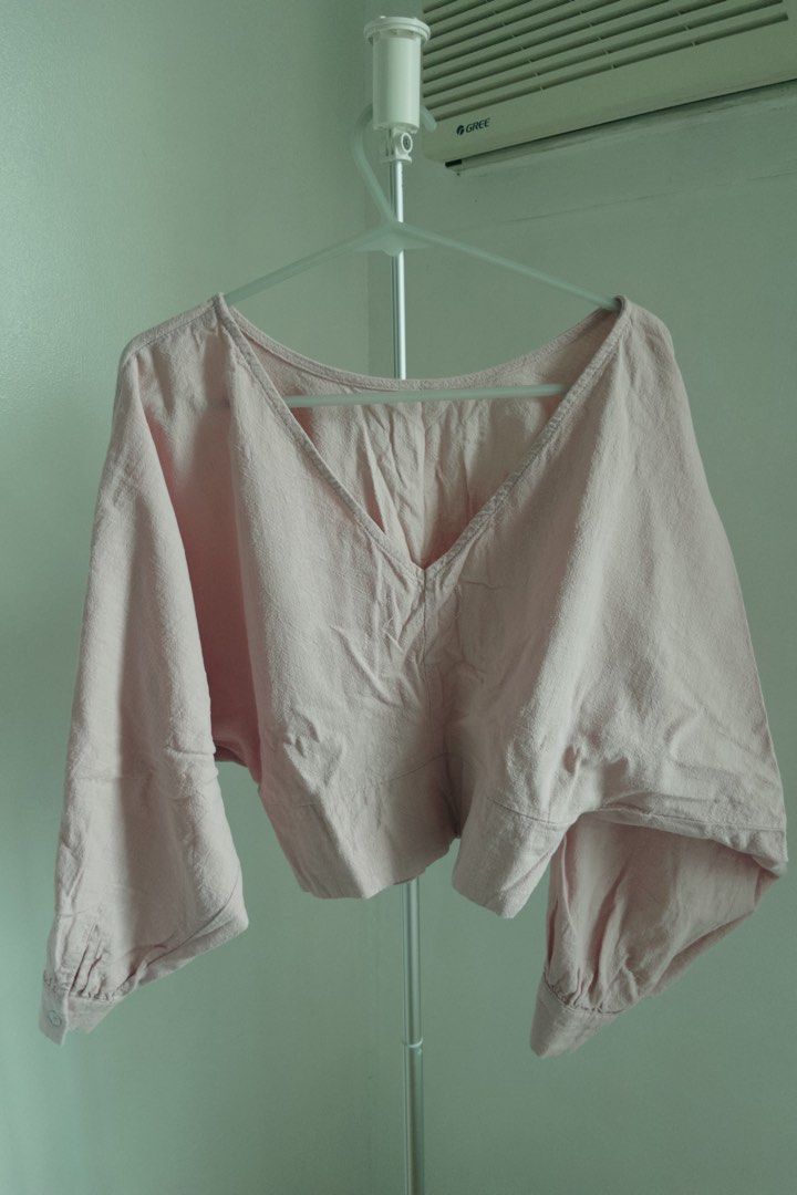 Bench Pink Crop Blouse Size Medium (Category: Blouses) located in Manila. Submitted by designforhumanity (Listing ID 1465621606, Image 2). Description: - Brand: Bench - Size: Medium - Color: Soft Pink - Style: V-neck cropped blouse with wide sleeves and button cuffs - Fit: Sits right at the waist - Condition: Great for casual everyday wear.