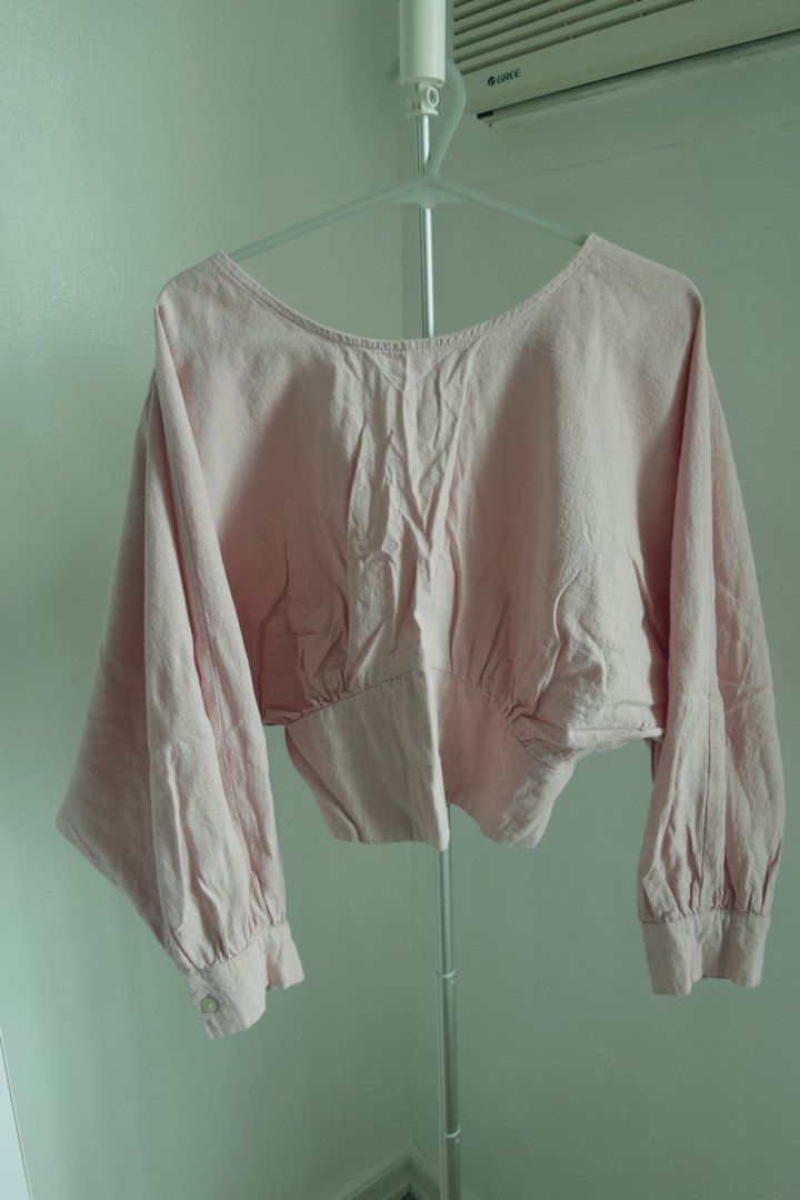 Bench Pink Crop Blouse Size Medium (Category: Blouses) located in Manila. Submitted by designforhumanity (Listing ID 1465621606, Image 1). Description: - Brand: Bench - Size: Medium - Color: Soft Pink - Style: V-neck cropped blouse with wide sleeves and button cuffs - Fit: Sits right at the waist - Condition: Great for casual everyday wear.